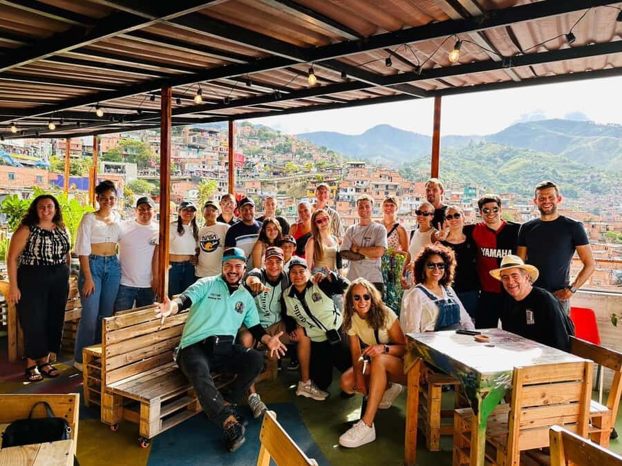 Medellín: Comuna 13 and Graffiti Guided Tour with a Local - San Javier meeting point: the green umbrella and the right metro exit