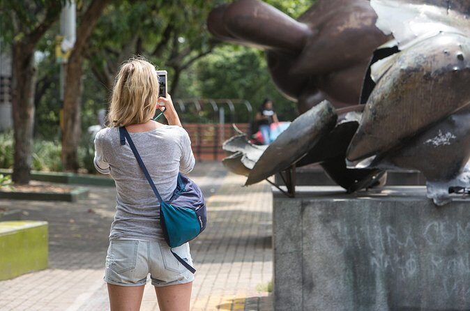 Medellin Historic Walking Tour with Expert Guide - Paseo Carabobo: from noisy street to pedestrian green corridor