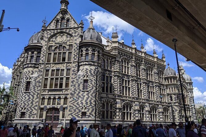 Medellin Historic Walking Tour with Expert Guide - Palacio Nacional: courts and jail now turned into art and coffee breaks