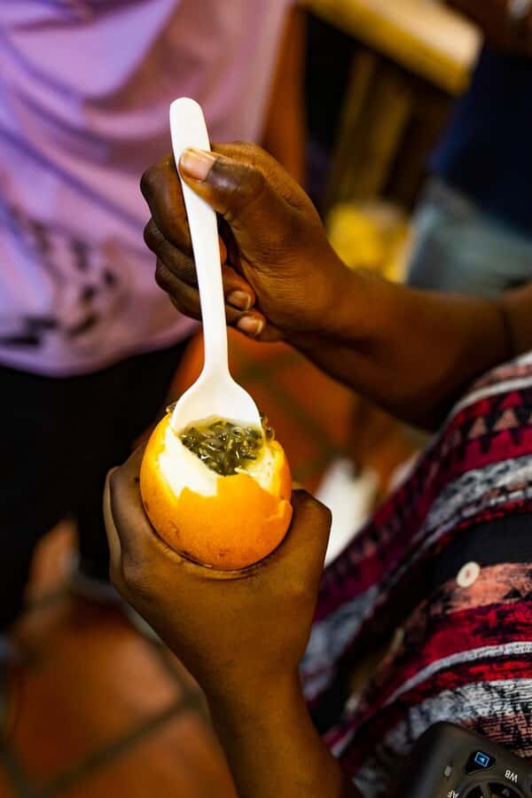 Medellín Multi-sensory Tour in the market, +15 Exotic Fruits - Finding the tour at Puerta 1 (P1) with the purple umbrella